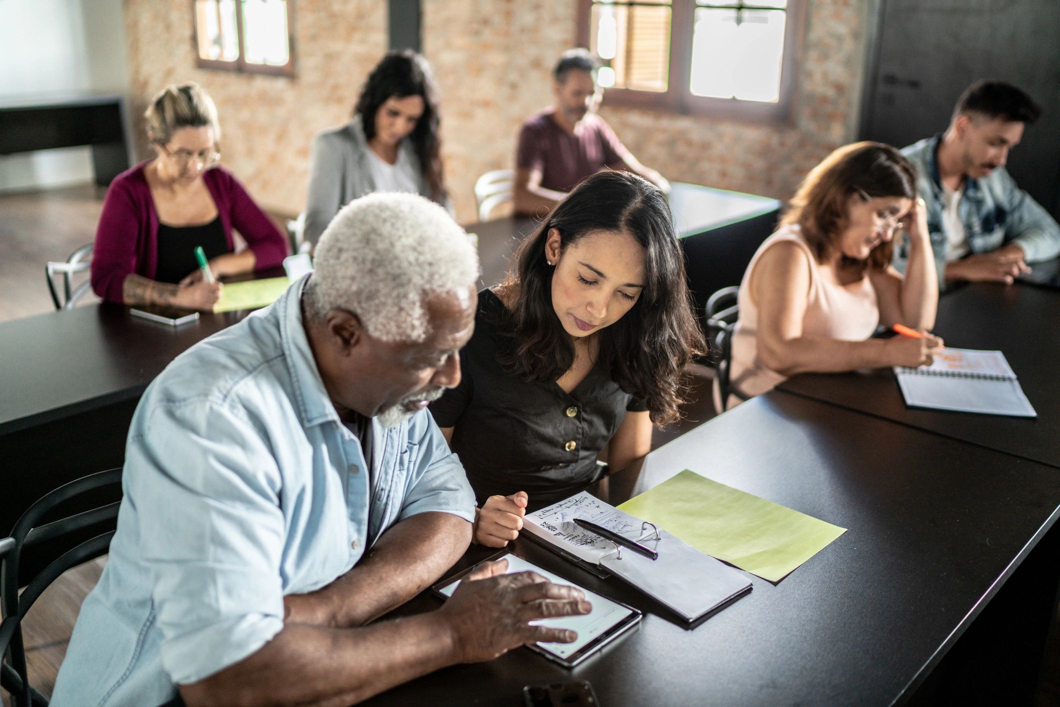 People talking in a classroom setting